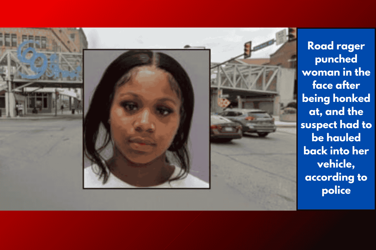 Road rager punched woman in the face after being honked at, and the suspect had to be hauled back into her vehicle, according to police