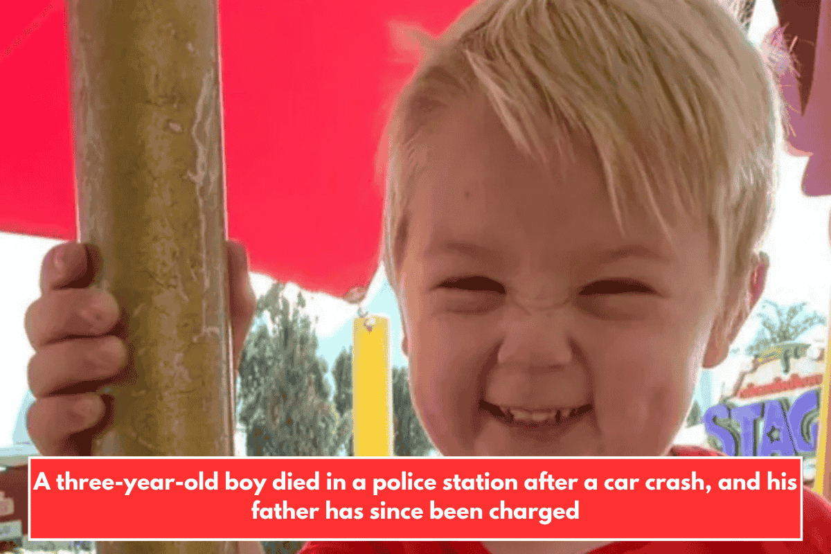 A three-year-old boy died in a police station after a car crash, and his father has since been charged