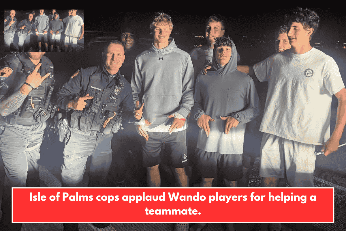 Isle of Palms cops applaud Wando players for helping a teammate.