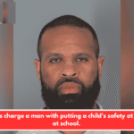 Deputies charge a man with putting a child's safety at danger at school.