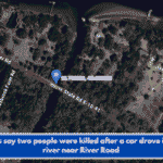 Officials say two people were killed after a car drove into the river near River Road