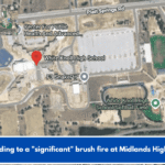 Responding to a "significant" brush fire at Midlands High School