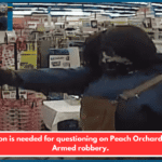 A person is needed for questioning on Peach Orchard Road. Armed robbery.