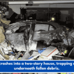 A car crashes into a two-story house, trapping a child underneath fallen debris.