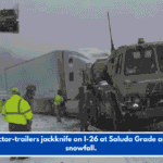 Tractor-trailers jackknife on I-26 at Saluda Grade amid snowfall.