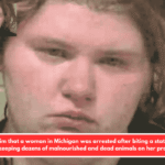 Police claim that a woman in Michigan was arrested after biting a state trooper while keeping dozens of malnourished and dead animals on her property.