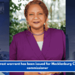 An arrest warrant has been issued for Mecklenburg County commissioner