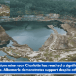 A lithium mine near Charlotte has reached a significant milestone. Albemarle demonstrates support despite other cuts.