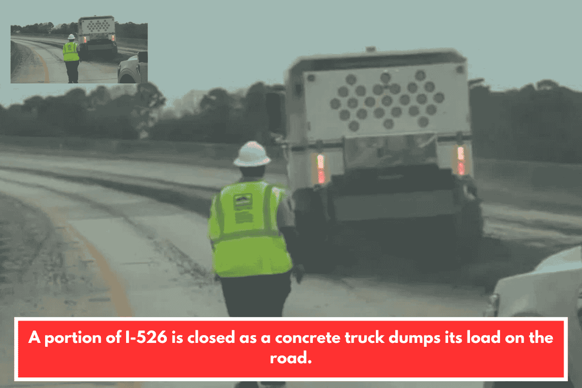 A portion of I-526 is closed as a concrete truck dumps its load on the road.