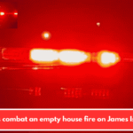 Crews combat an empty house fire on James Island.