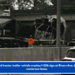 High-load tractor trailer vehicle crashes I-526 sign at Rivers Ave, blocking numerous lanes.