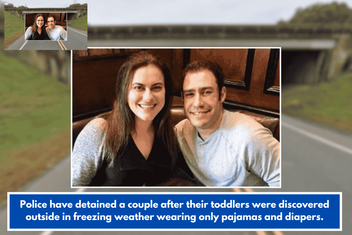 Police have detained a couple after their toddlers were discovered outside in freezing weather wearing only pajamas and diapers.