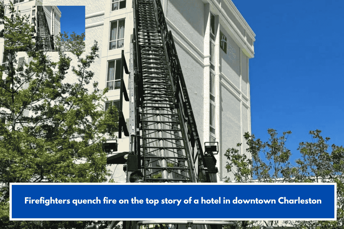 Firefighters quench fire on the top story of a hotel in downtown Charleston