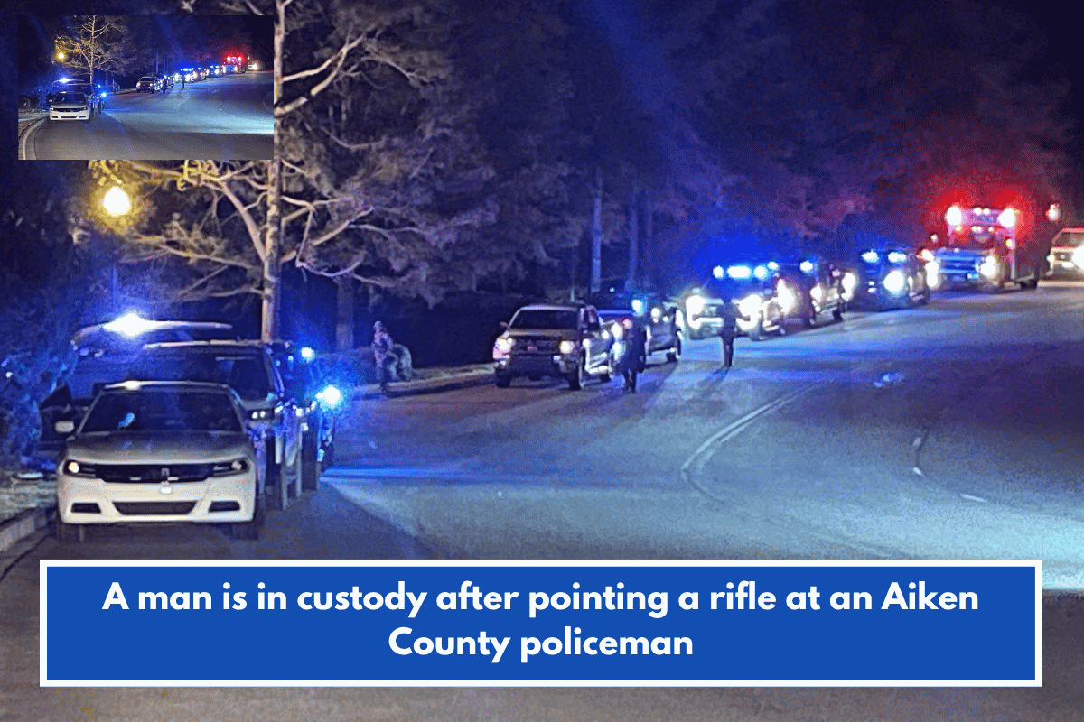 A man is in custody after pointing a rifle at an Aiken County policeman